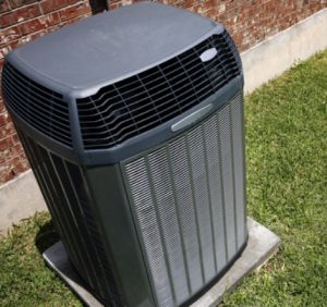 Outdoor AC unit next to a home